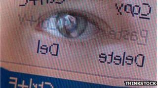 Eye reflected in computer screen