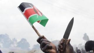 A Kenyan flag and knife held aloft after elections in December 2007