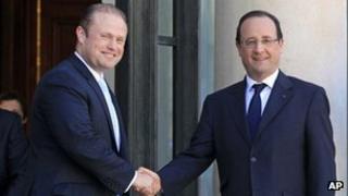 Maltese Prime Minister Joseph Muscat and French President Francois Hollande