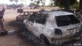 Policeman inspects site at Bama in Nigeria (May 7 2013)