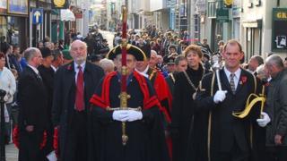 John Mattick carrying Carmarthen's ceremonial sword