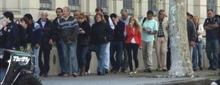 Argentines queuing at Uruguayan cash machine