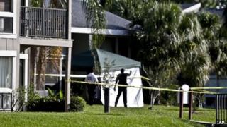 Investigators outside an apartment complex where a man was fatally shot by the FBI in Orlando, Florida, on 22 May 2013