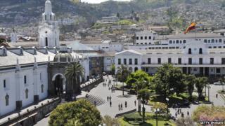Quito's Plaza Grande square with its Spanish colonial architecture is dominated by the presidential palace, Ecuador's flag fluttering above