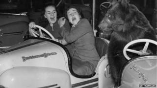 Two ladies in a bumper car at Olympia in 1954 get a shock