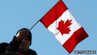Man waves Canada flag