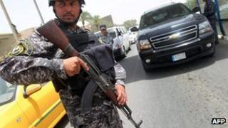 Iraqi policeman at a checkpoint in Baghdad. Photo: 29 May 2013