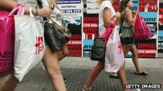 Shoppers walk down Broadway in Manhattan, New York