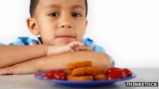 Child and fish fingers