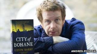 Kevin Barry with his book
