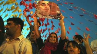 Iranian supporters of presidential candidate Hassan Rouhani celebrate in Tehran