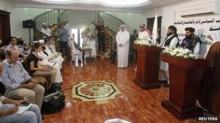 Taliban spokesman Mohammed Naeem, second right, at opening of Doha office. 18 June 2013
