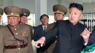File photo: North Korean leader Kim Jong-un (centre) inspects the Songchongang net-weaving factory in South Hamgyong province, North Korea.