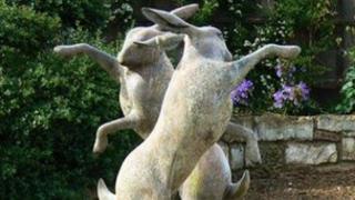 Dancing hares statue