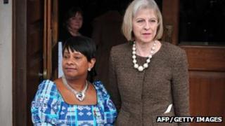 Home Secretary Theresa May (right) with Doreen Lawrence, mother of murdered teenager Stephen Lawrence, outside St Martin-in-the-Fields Church in central London on 22 April 2013 as they attend a memorial marking the 20th anniversary of his death