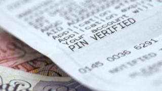 A receipt on top of some banknotes