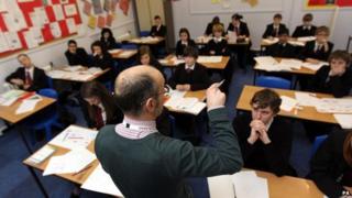 Teacher and pupils in lesson