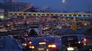 Commuters wait to pay their tolls on the San Francisco-Oakland Bay Bridge 1 July 2013