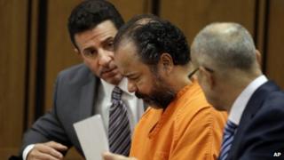 Ariel Castro, centre, confers with his lawyers during a pre-trial hearing in Cuyahoga County Common Pleas Court in Cleveland 3 July 2013