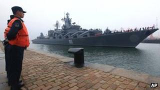 Russian Pacific Fleet's flagship Varyag, a Slava-class guided missile cruiser, arrives at a naval base in Qingdao, east China's Shandong Province, 21 April 2012
