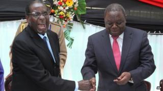 Robert Mugabe (on left) and Morgan Tsvangirai in Harare on 22 May 2013