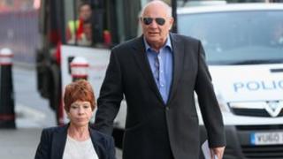 Eddy Shah arrives with his wife Jennifer at the Old Bailey on May 7, 2013