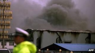 Smoke rises from Baoyuan poultry plant that caught fire at Dehui, north-east China's Jilin province on Monday