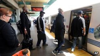 Passengers board a Bart train at West Oakland on Friday 5 July 2013