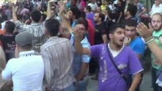 YouTube clip said to be taken in Garden Palace area of Aleppo on 9 July showing crowds calling for the end of the siege.