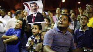 Supporters of a pro-Morsi sit in in Cairo on 11 July 2013