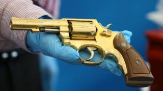 A replica golden gun was displayed as part of the dissident weapon haul