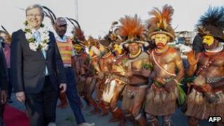 Australian Prime Minister Kevin Rudd (left) arrives in Port Moresby on 14 July 2013