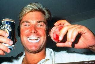 Shane Warne in 1994 with a tin of Foster's and a cricket ball