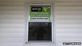 Auction sign in the window of a foreclosed property in Ohio