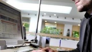 Man sitting at a computer