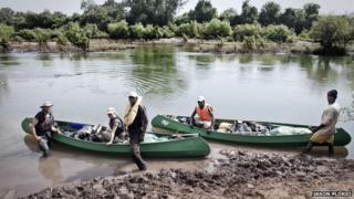 Jason Florio, Helen Jones-Florio, Abdou Ndong, Ebou Jarju and Yousef Keita prepare to leave Kedougou, Senegal on the first day of their River Gambia expedition