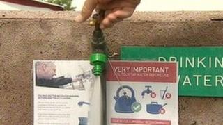 Drinking water tap and boiling sign