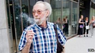 Friedhelm Adolfs smokes in front of the district court in Dusseldorf. Photo: 24 July 2013
