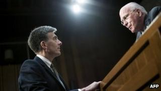 John Inglis deputy director of the National Security Agency, speaks with committee chairman Senator Patrick Leahy (D-VT) after testifying during a hearing of the Senate Judiciary Committee on Capitol Hill 31 July 2013 in Washington, DC