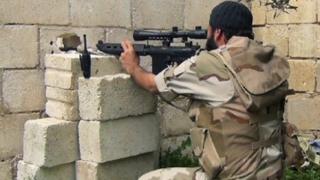 Sniper from Nusra Front aiming towards Syrian troops