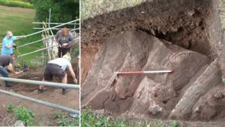 Volunteer archaeologists dig at Holt Castle; one of the foundation stones