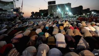 Supporters of the deposed president Mohammed Morsi perform evening prayer at Rabaa al-Adawiya square in Cairo