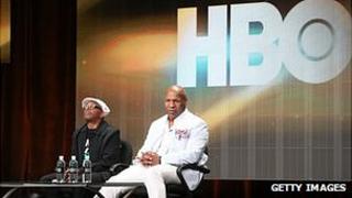 Mike Tyson and Spike Lee in front of a HBO logo