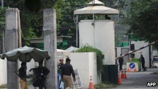 Pakistani security personnel stand guard outside the US consulate in Lahore on 5 August 2013