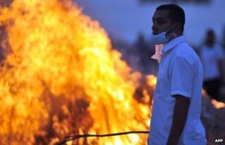 A member of the Muslim Brotherhood and supporter of ousted Egyptian President Mohammed Morsi during clashes near a television production complex in Six October City in Giza, south of Cairo 2 August, 2013.
