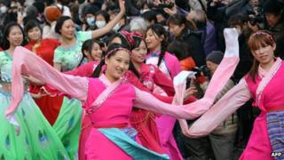 People of Chinese descent perform an ethnic Chinese dance to celebrate the Lunar New Year in Japan's largest Chinatown in Yokohama, suburban Tokyo, 17 February 2013