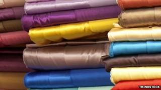Stack of colourful fabric (stockshot)