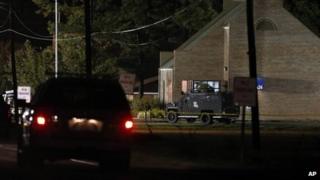 Louisiana law enforcement near bank during a hostage situation in St Joseph, on 13 August 2013