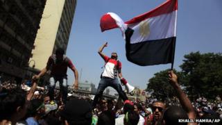 Muslim Brotherhood supporters with national flag in Cairo's Ramses Square (16 August 2013)
