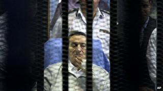 Former Egyptian President Hosni Mubarak attends an April hearing session in his retrial in Cairo